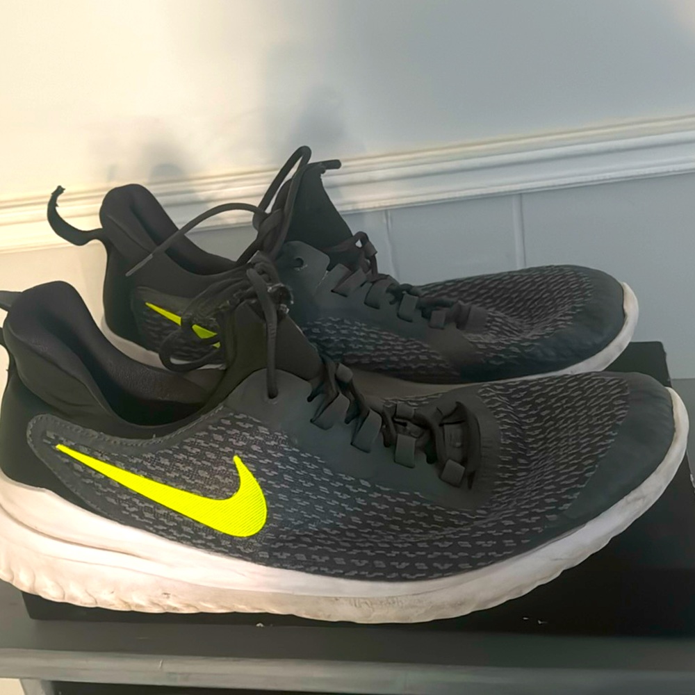 Men’s size 14 running shoes by Nike, charcoal grey. Gently used.